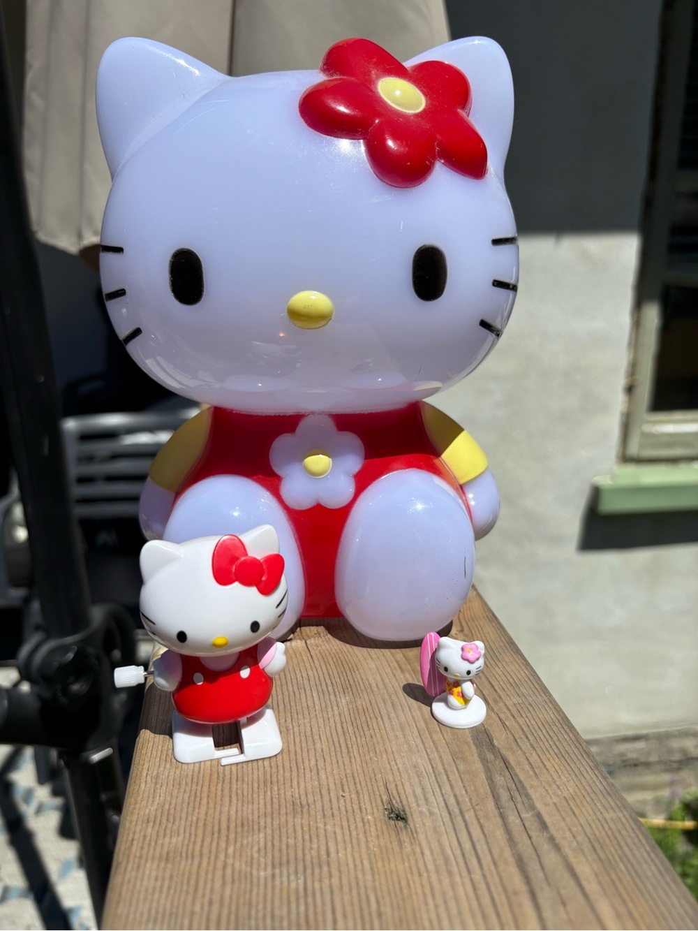 Hello Kitty Piggy Bank, wind up toy and tiny surfer figure